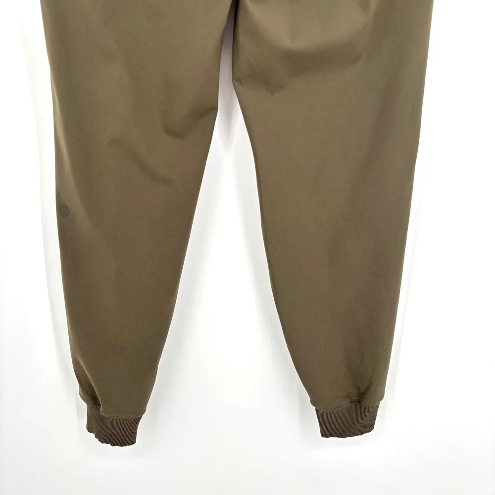 Lululemon‎ On The Fly Jogger 7/8 Mid Rise Olive Green Stretch Drawstring Size 6